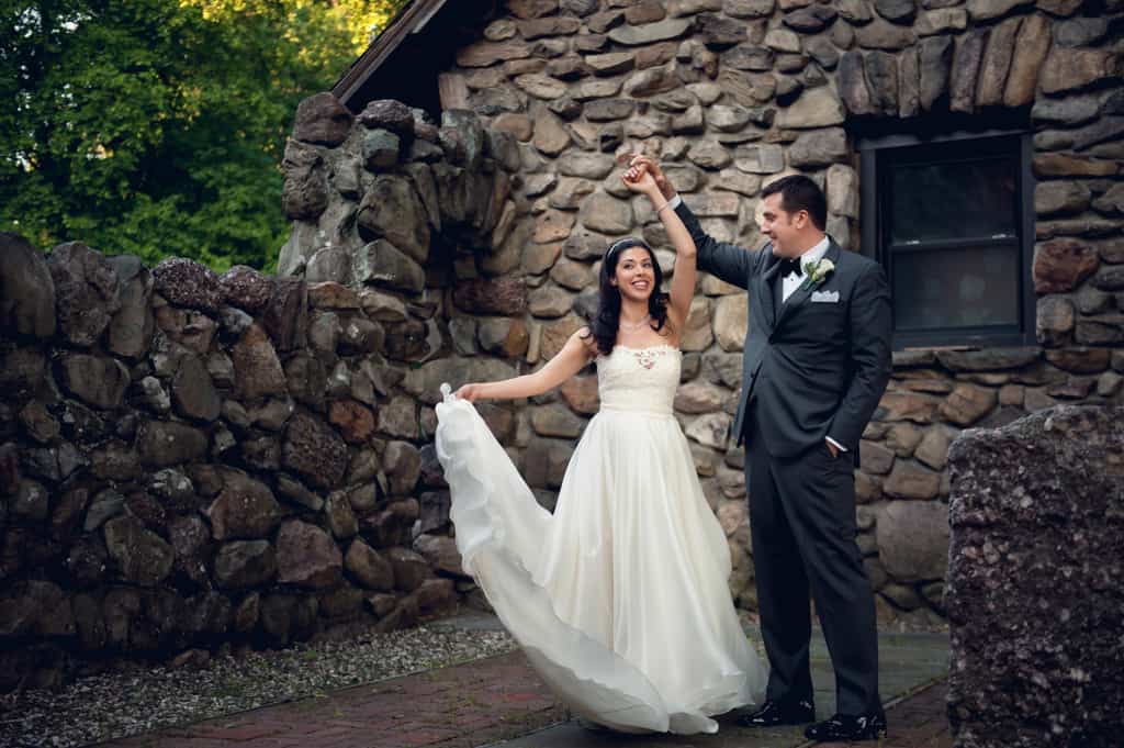 groom twirling bride in rosa clara dress