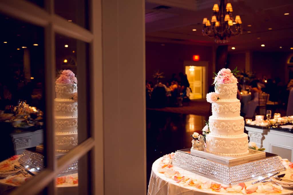 four tier ivory wedding cake with pink peonies 