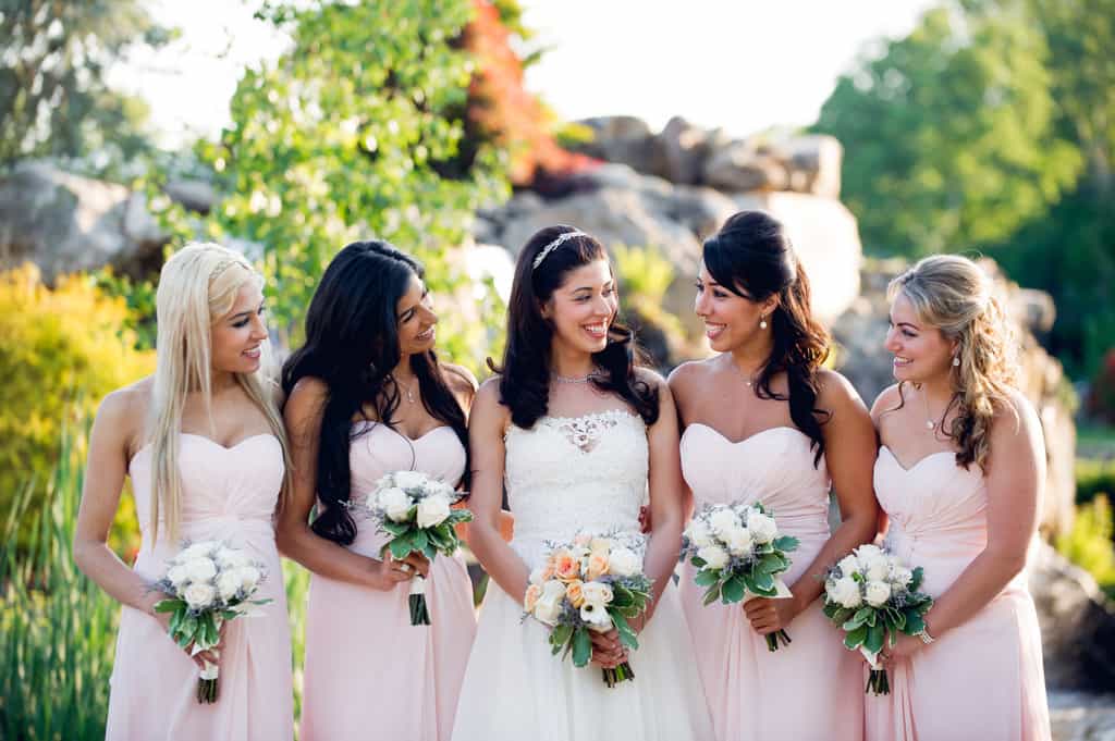 bridesmaids in pale pink strapless dresses