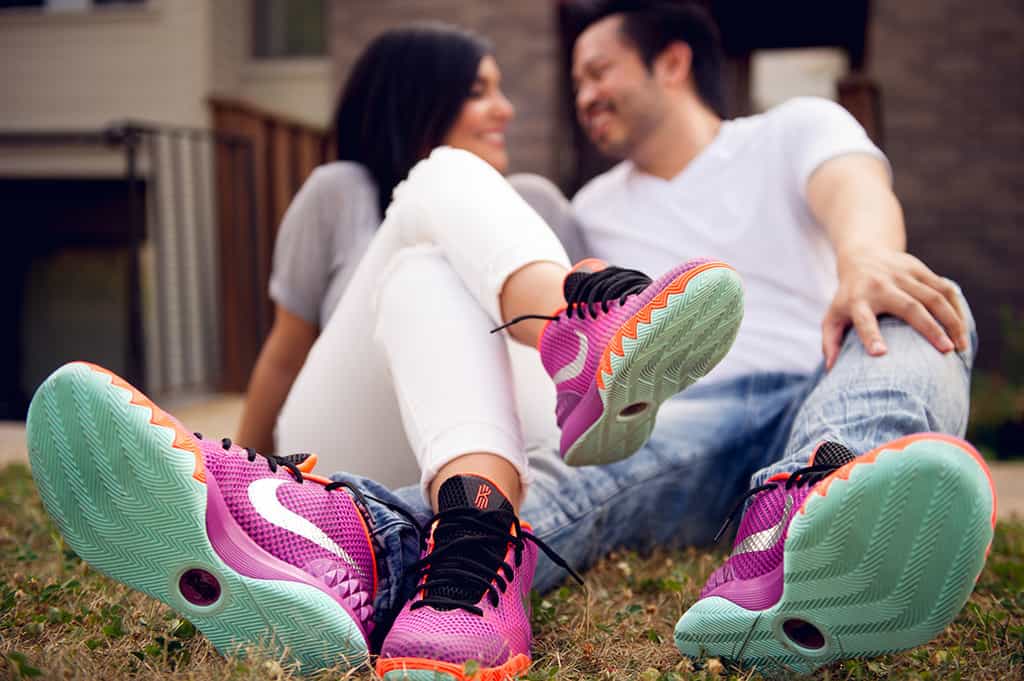 engaged couple with matching nike sneakers