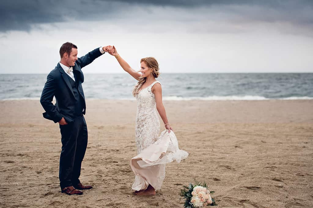 bride and groom dancing on beach on NJ shore