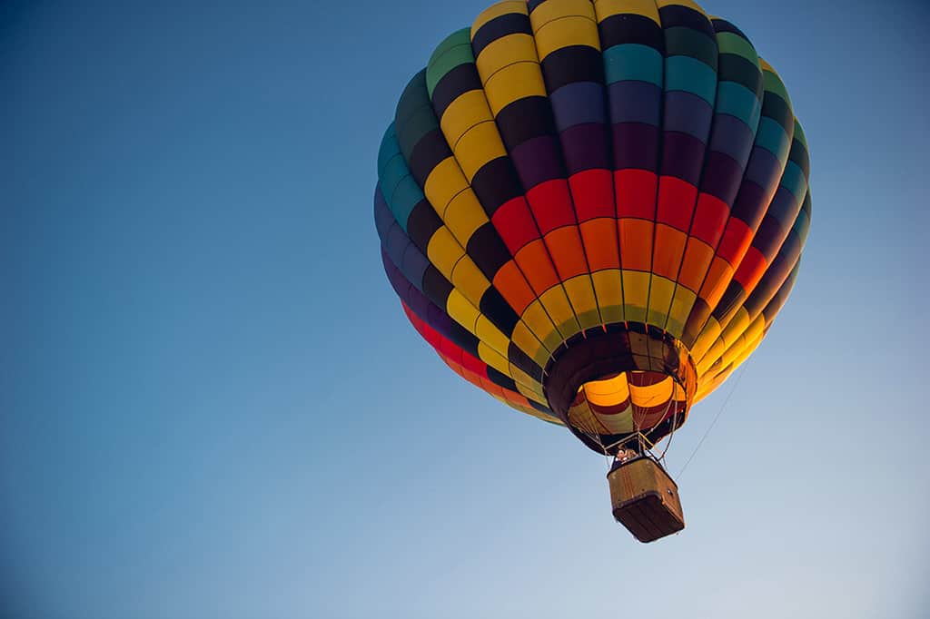 couple riding in hot air balloon