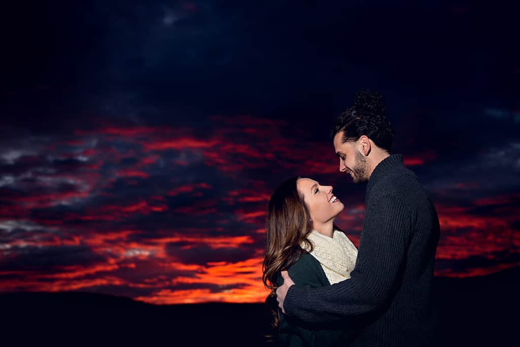 engaged couple at sunset