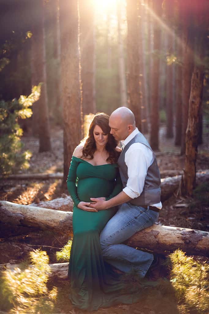 Ethereal Maternity Session in Forest with emerald green gown with train