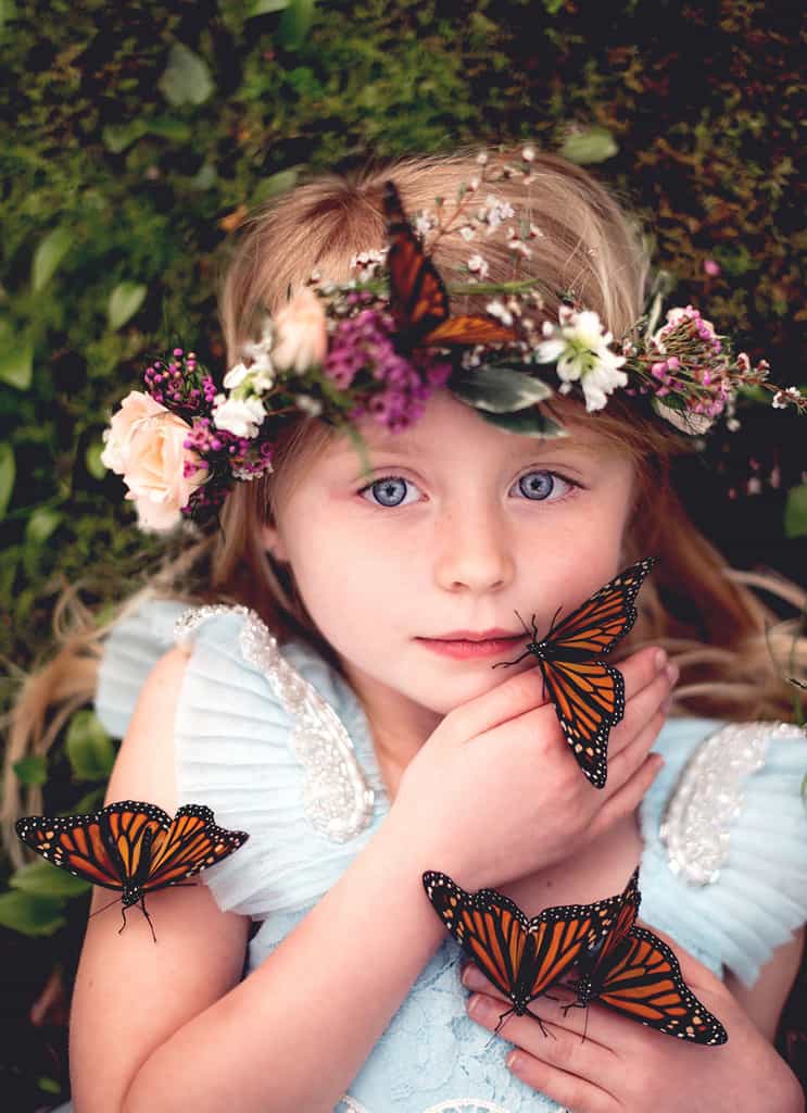 magical girls portrait holding butterflies