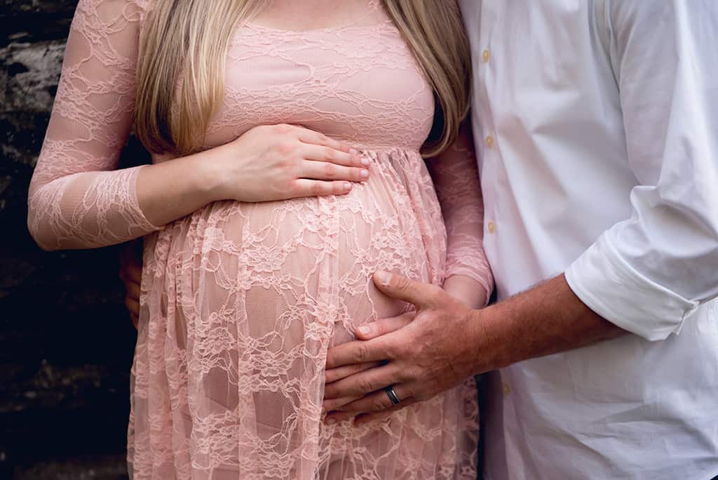 Spring maternity shoot with ethereal pink lace maternity dress