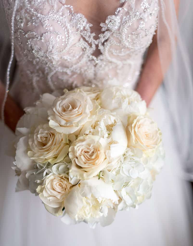 cream bridal bouquet of peonies and roses