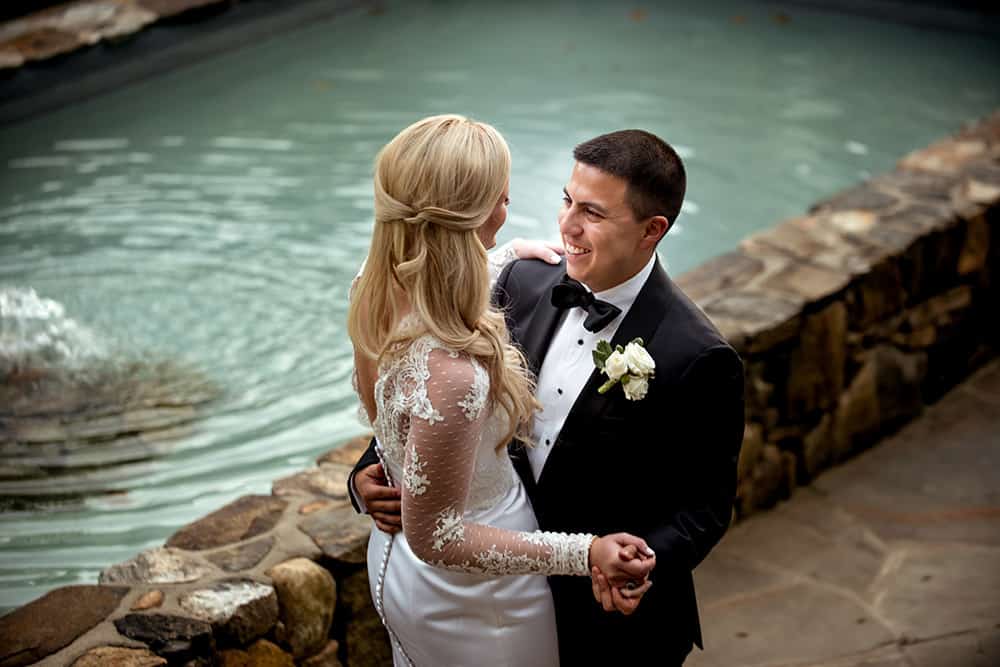 Romantic Bride and Groom portrait by pool at bedford post inn