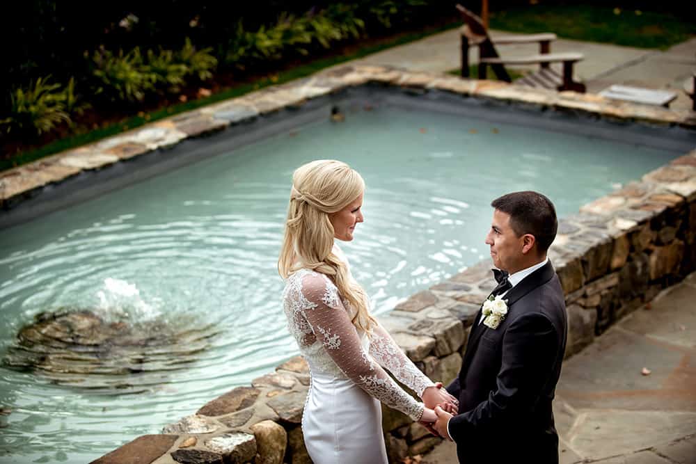 Romantic Bride and Groom portrait by pool at bedford post inn