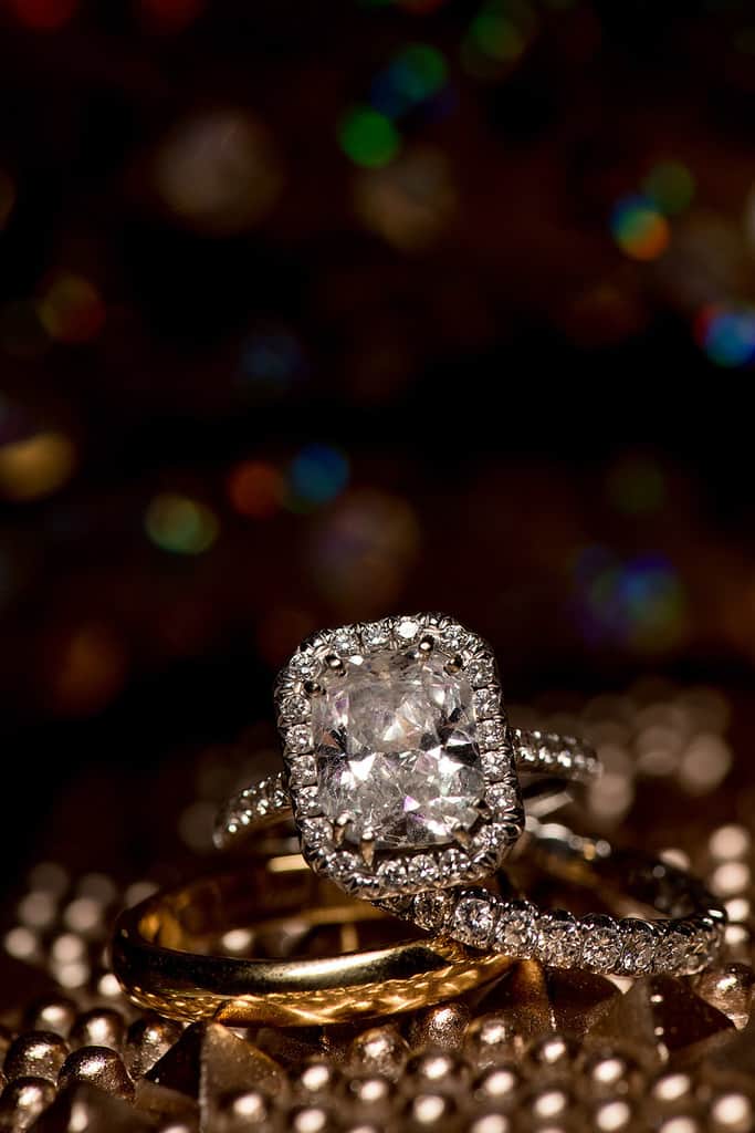 radiant cut engagement ring with pave diamonds and wediding bands