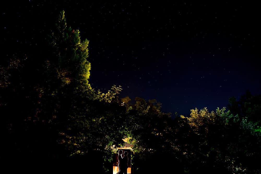 creative bride and groom evening portrait under the stars at bedford post inn wedding