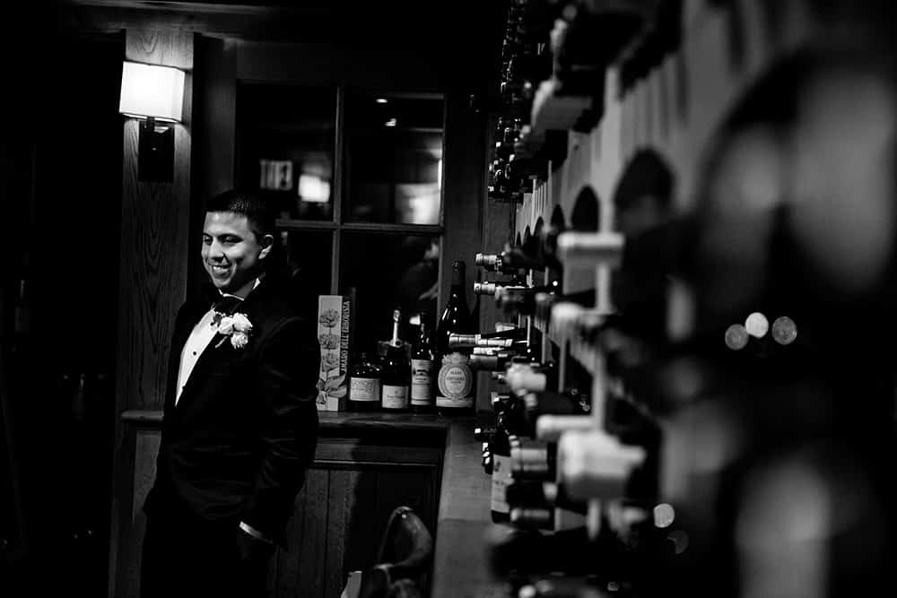 groom portrait in wine cellar at bedford post inn
