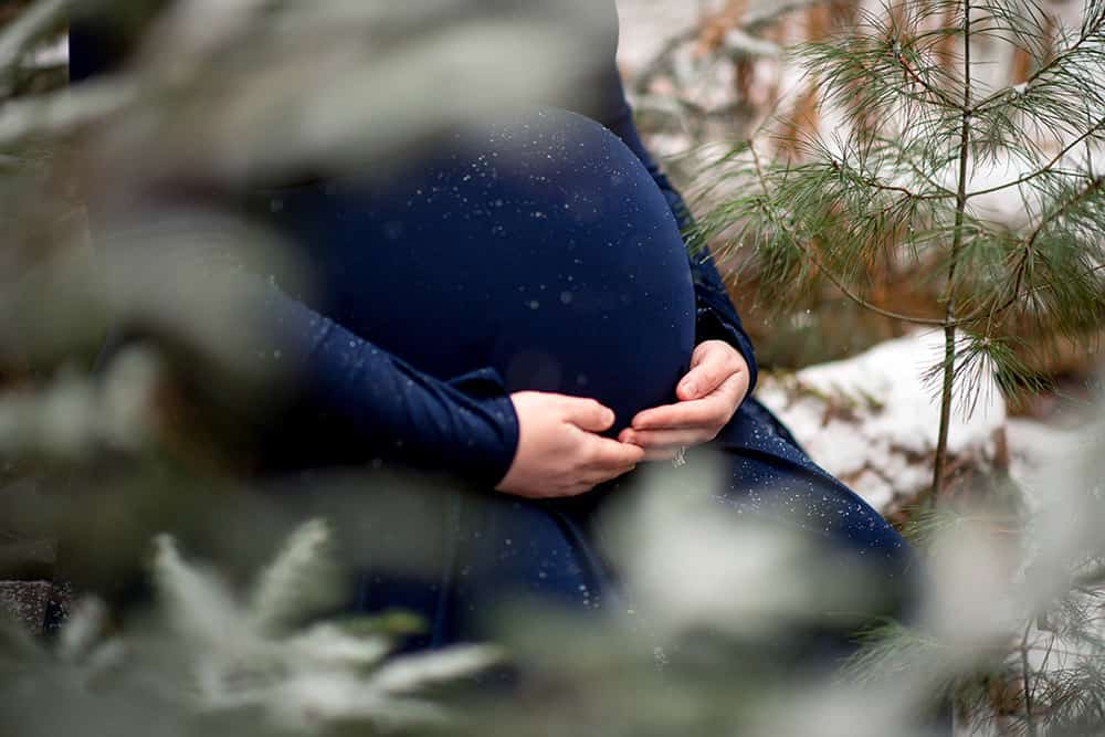 Winter Maternity Session with Navy Blue Maternity Gown Belly Picture