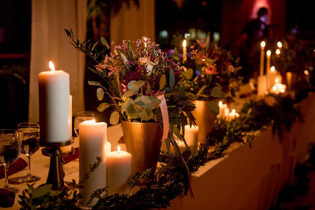 Romantic Candlelit New Year's Eve wedding head table at Helsinki Hudson