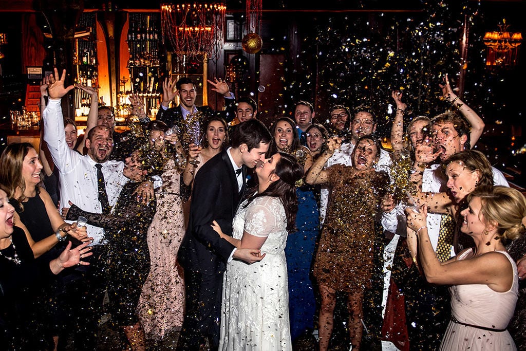 Throwing confetti on bride and groom at New Years Eve wedding at Helsinki Hudson