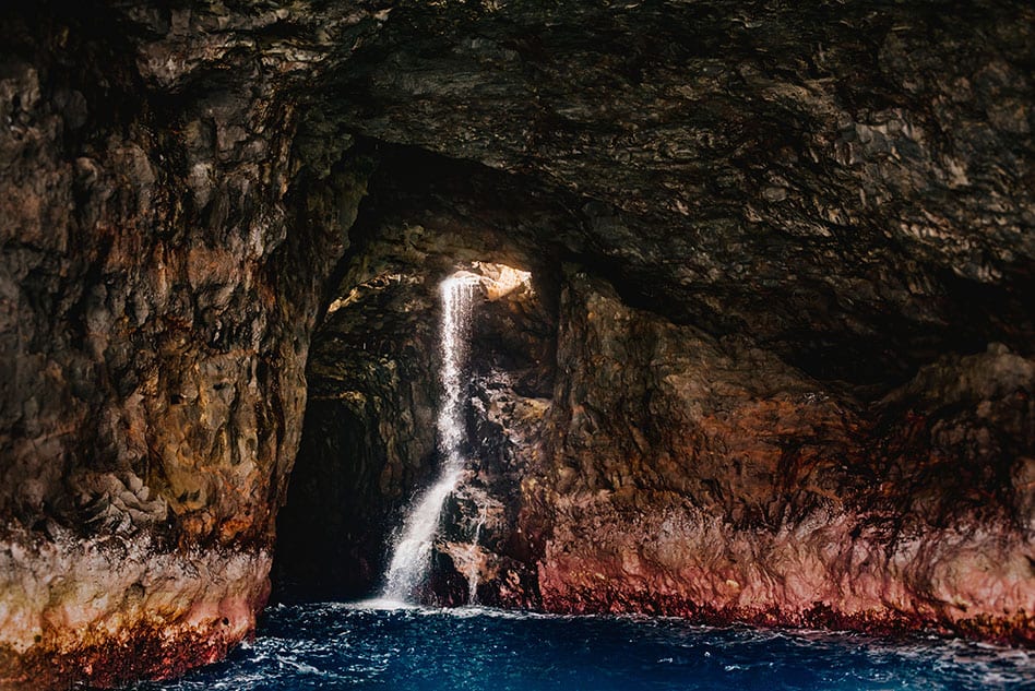 Sea caves on Na Pali Coast Holo Holo Charters sunset cruise on Kauai Hawaii