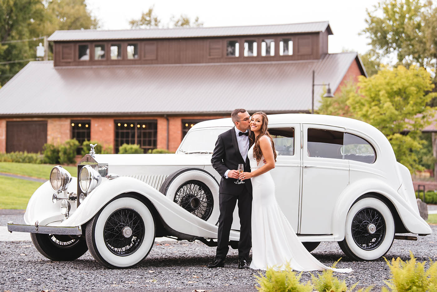 bride and groom with vintage rolls royce at Hutton Brickyards wedding 