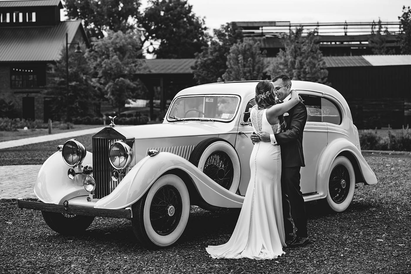 bride and groom with vintage rolls royce at Hutton Brickyards wedding 