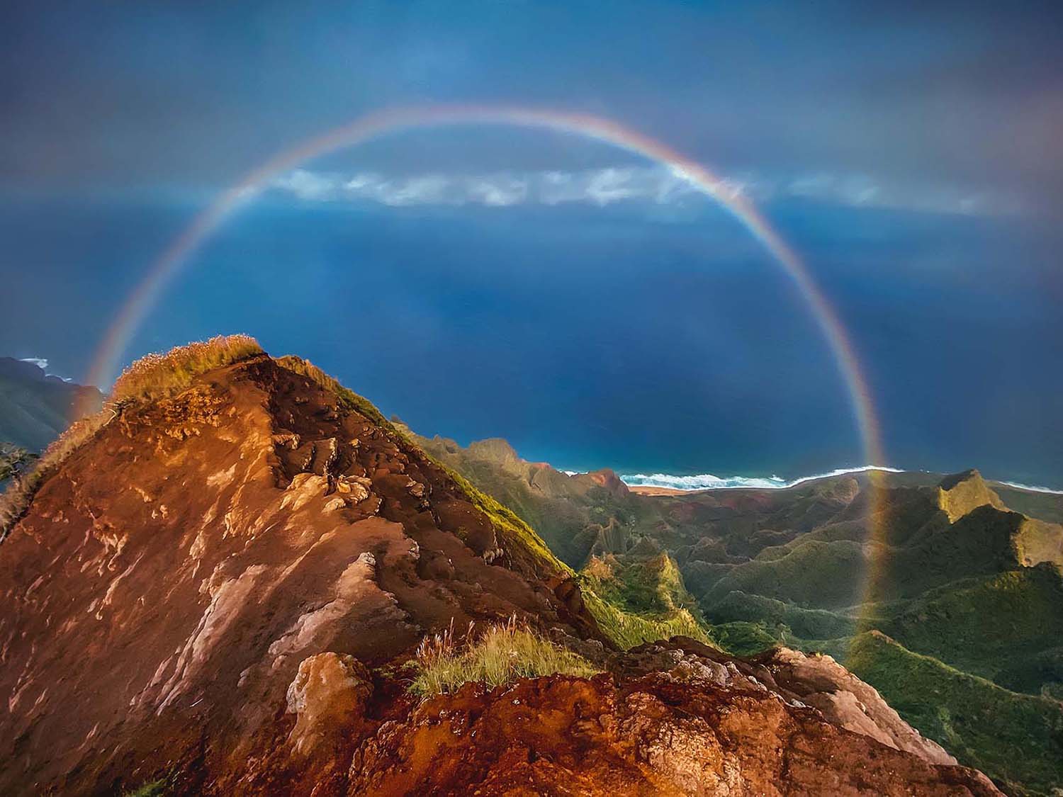 Rainbow on Napli Coast hike in Kauai Hawaii