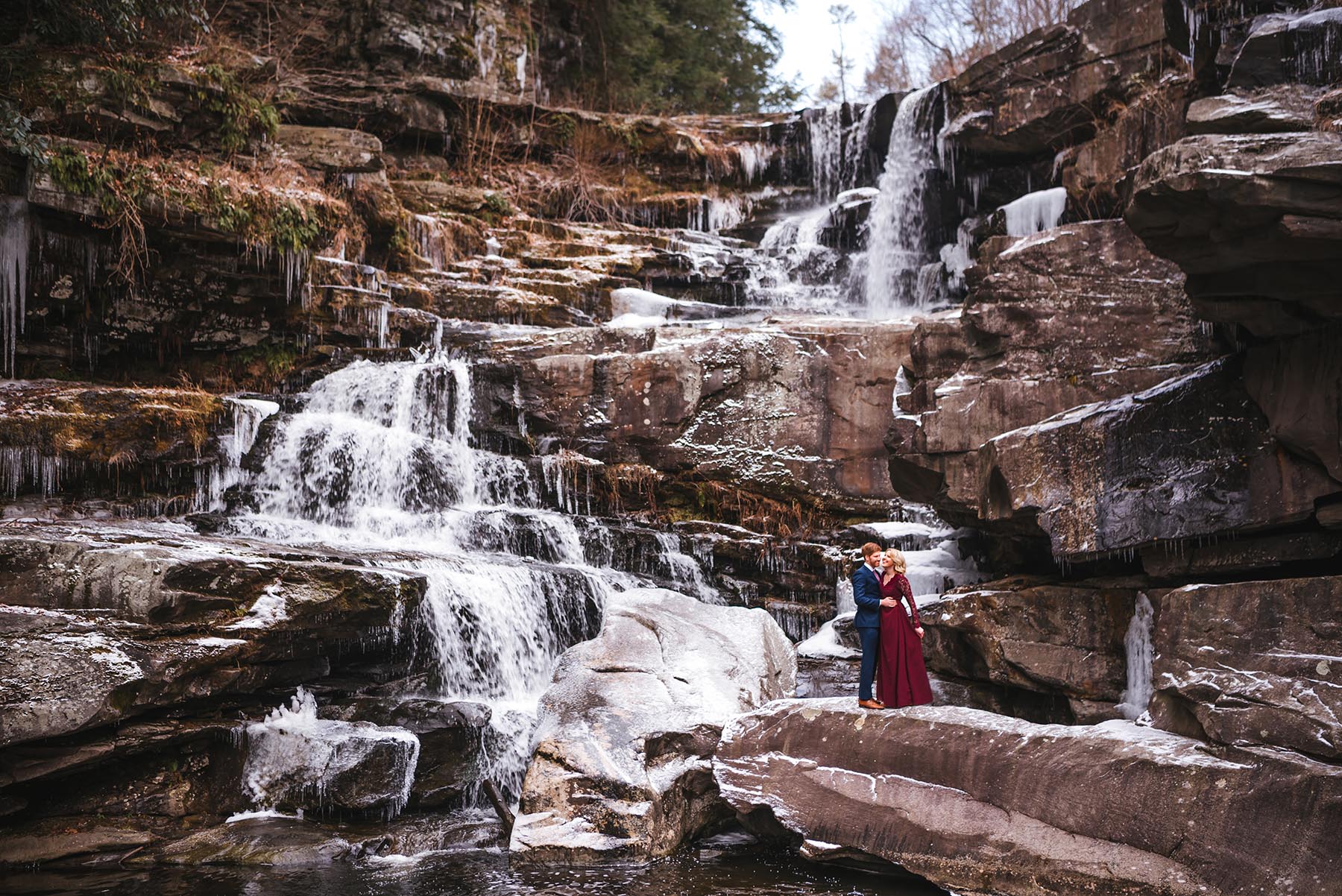 Poconos winter waterfall engagement at Ledges Hotel